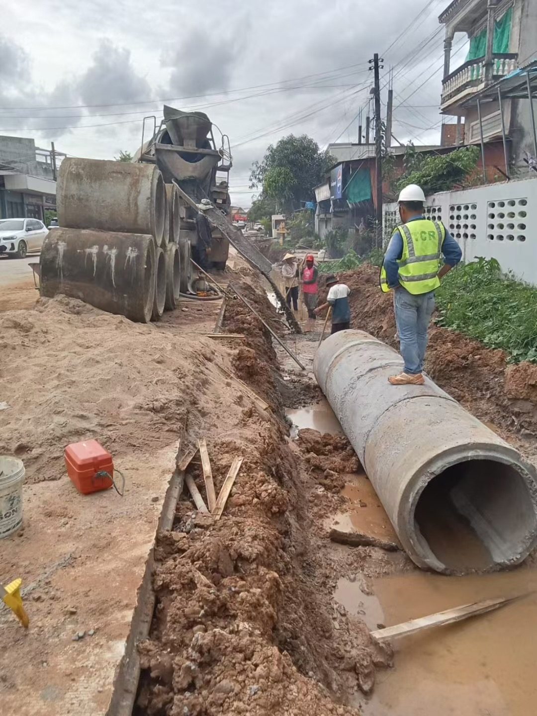 TCR concrete community road resurfacing in Pakse